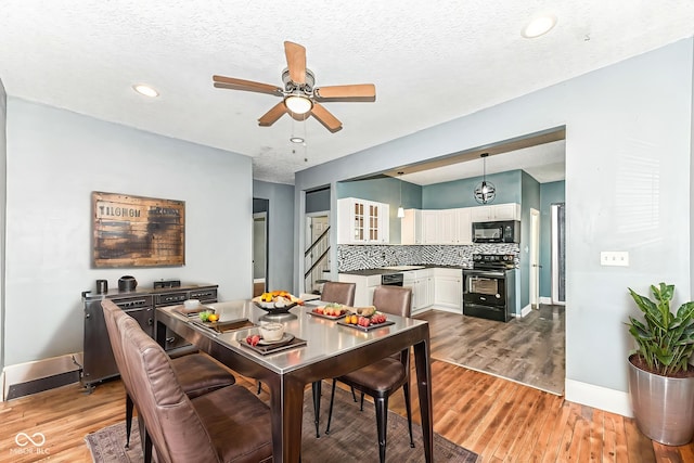 3458 N Kenwood Ave, Indianapolis, IN 46208 - dining space featuring a ceiling fan, light wood-type flooring, stairs, recessed lighting, and a textured ceiling