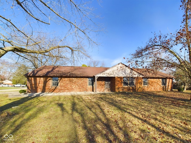 single story home featuring a front yard