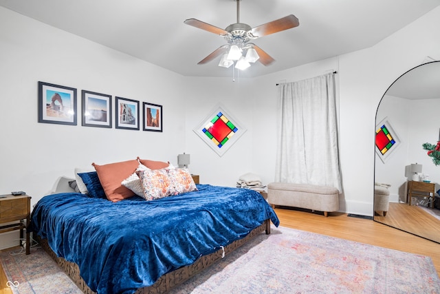 bedroom featuring hardwood / wood-style flooring and ceiling fan