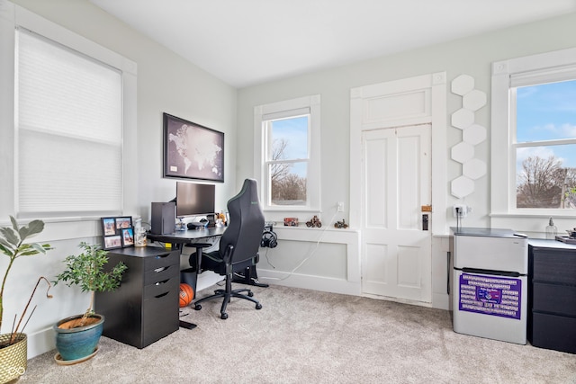 office space with a healthy amount of sunlight and light colored carpet