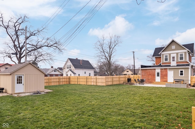 view of yard with a patio area and a shed