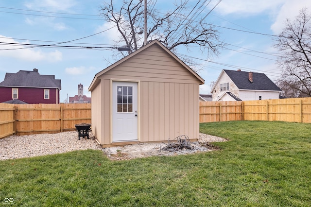 view of outbuilding with a lawn