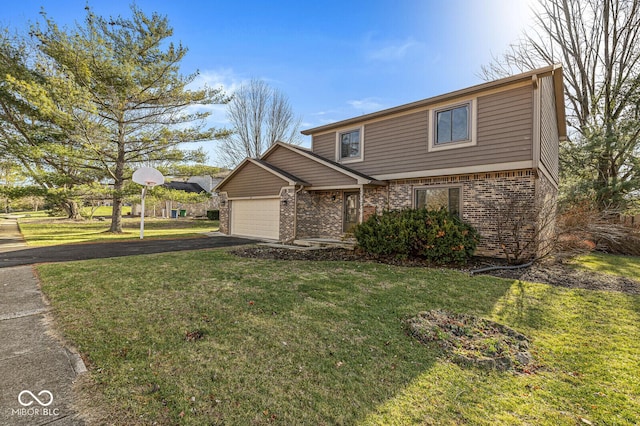 view of front of home with a front lawn and a garage