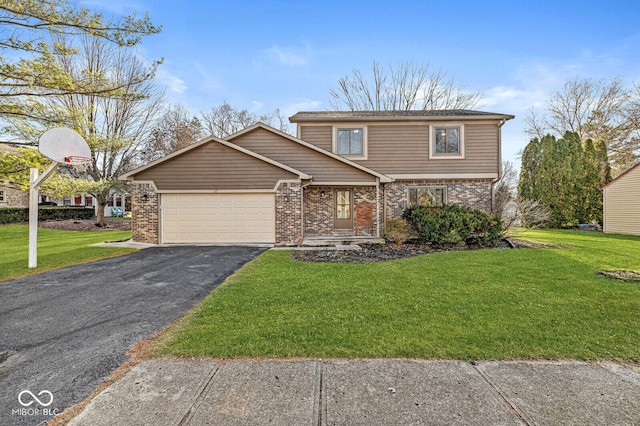 view of front of property with a garage and a front lawn