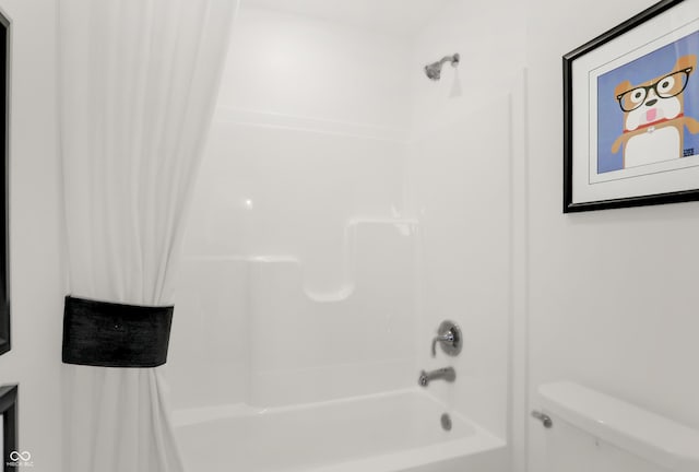 bathroom with shower / bath combination with curtain and toilet