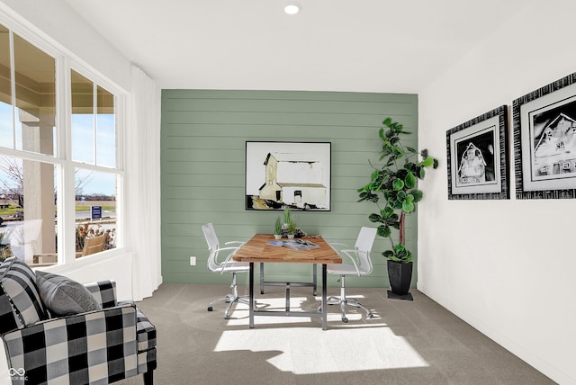 carpeted office with wooden walls