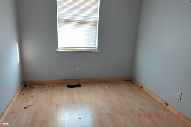 spare room featuring light hardwood / wood-style floors