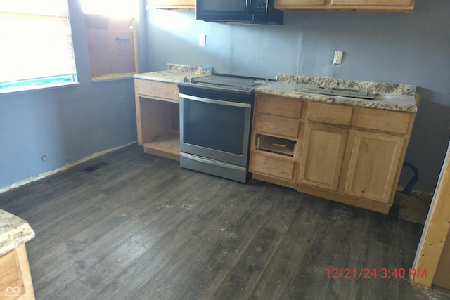 kitchen with stainless steel range oven and dark wood-type flooring