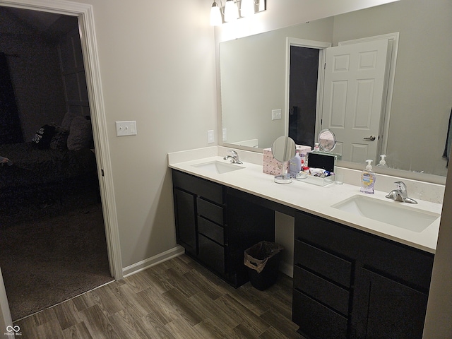 bathroom with vanity and wood-type flooring