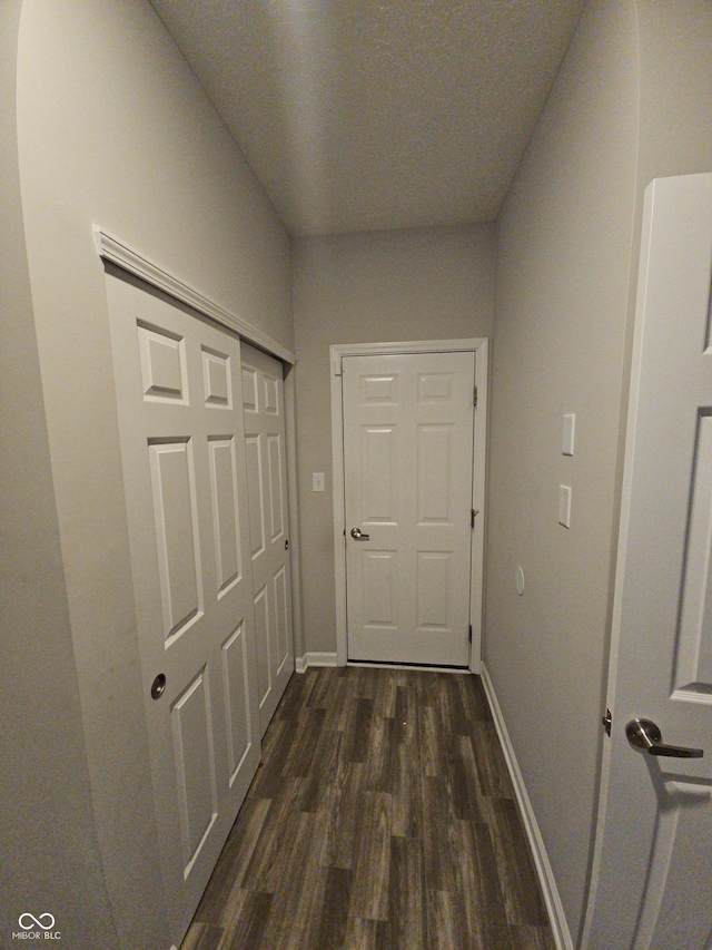 hallway featuring dark hardwood / wood-style floors