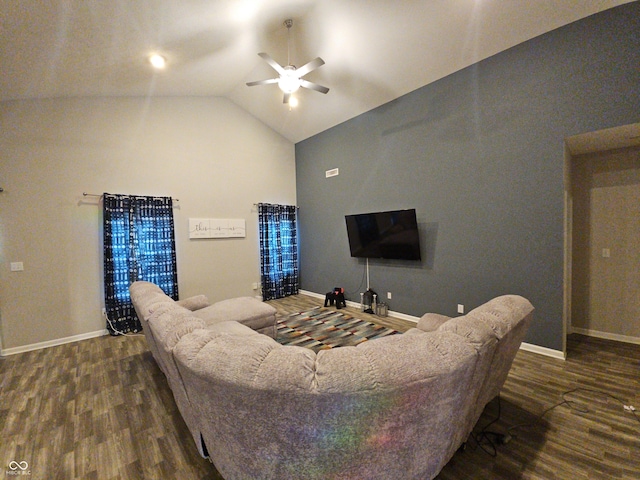 living room featuring dark hardwood / wood-style flooring, ceiling fan, and lofted ceiling