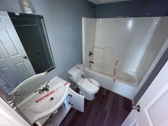 6215 E 11th St, Indianapolis, IN 46219 - bathroom with wood finished floors, bathing tub / shower combination, and vanity