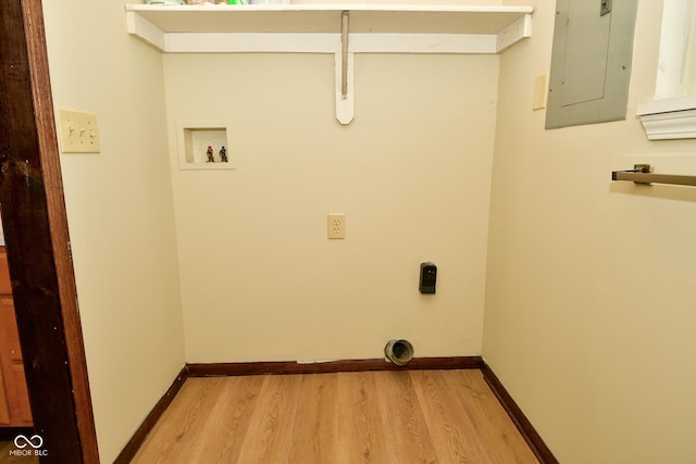 laundry area featuring hookup for an electric dryer, electric panel, hookup for a washing machine, and light hardwood / wood-style flooring