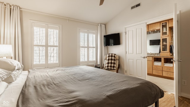 bedroom featuring vaulted ceiling and ceiling fan