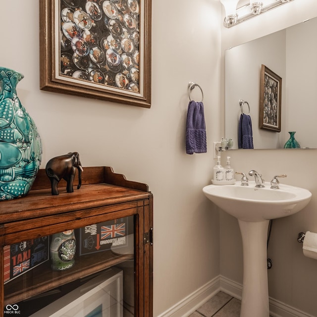 bathroom featuring tile patterned flooring and sink