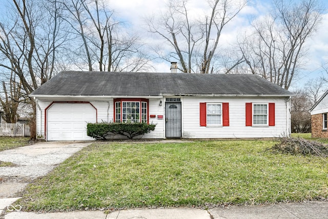 view of front of house featuring a front yard and a garage