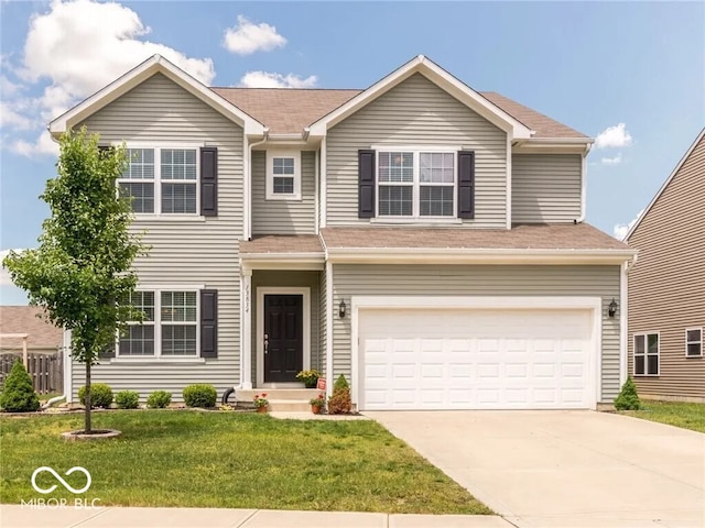 traditional-style house with driveway, an attached garage, and a front lawn