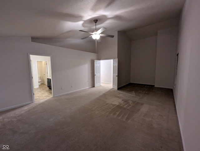 bonus room featuring vaulted ceiling, light colored carpet, a textured ceiling, and ceiling fan