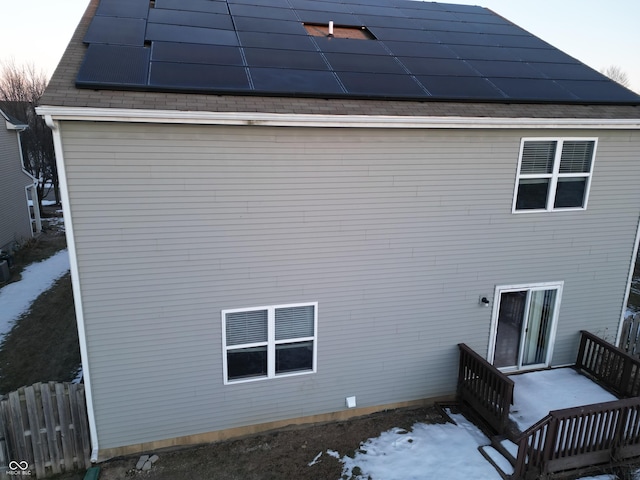 back house at dusk with solar panels