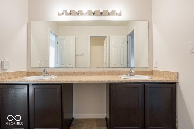 bathroom with double vanity and a sink