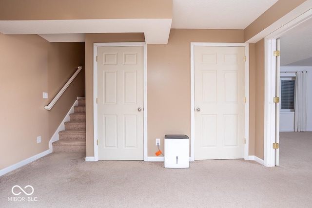 unfurnished bedroom featuring carpet floors and baseboards