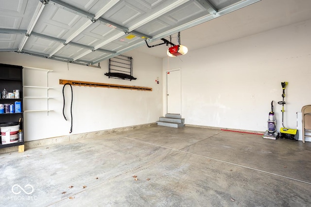 garage featuring baseboards and a garage door opener