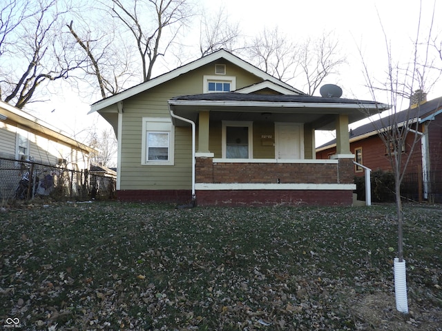 bungalow featuring a porch and a front yard