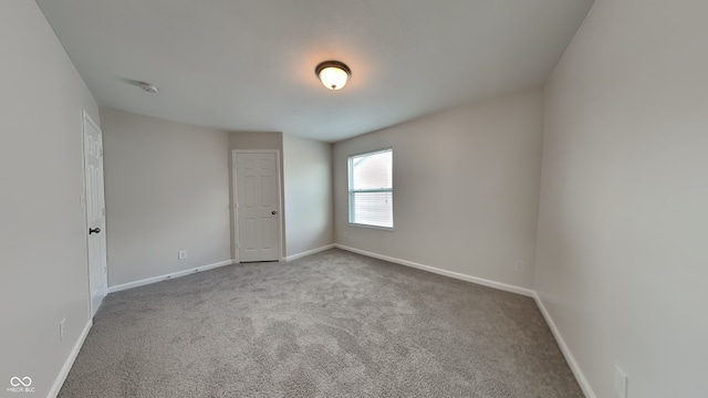 empty room featuring light colored carpet