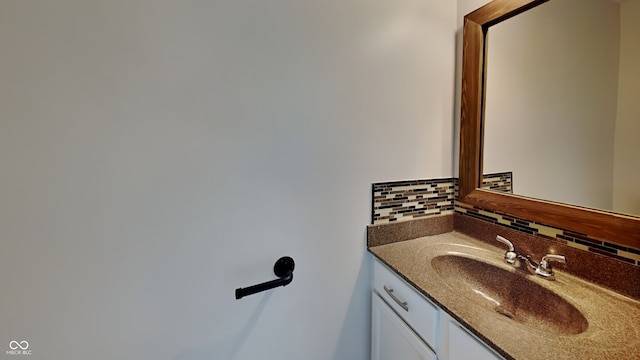 bathroom featuring decorative backsplash and vanity