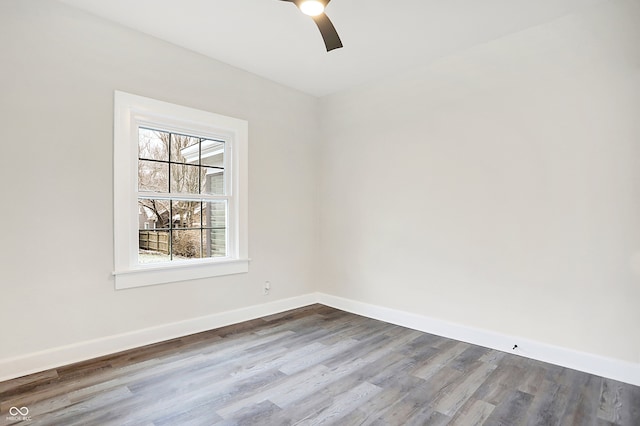 unfurnished room with hardwood / wood-style floors and ceiling fan