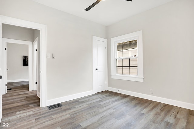 unfurnished room featuring ceiling fan and light hardwood / wood-style flooring