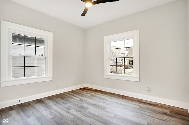 empty room featuring ceiling fan and light hardwood / wood-style floors