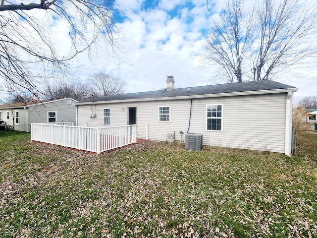 back of house with a yard, central AC unit, and a deck