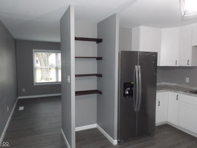 kitchen featuring white cabinetry, dark wood-type flooring, and stainless steel refrigerator with ice dispenser