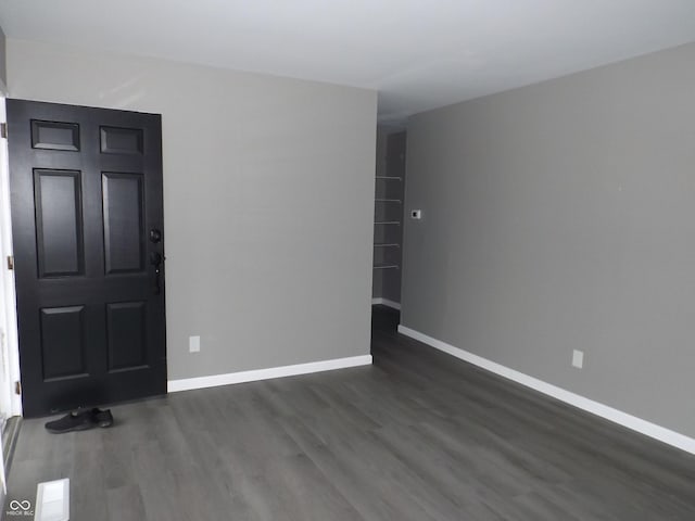 empty room featuring dark hardwood / wood-style floors