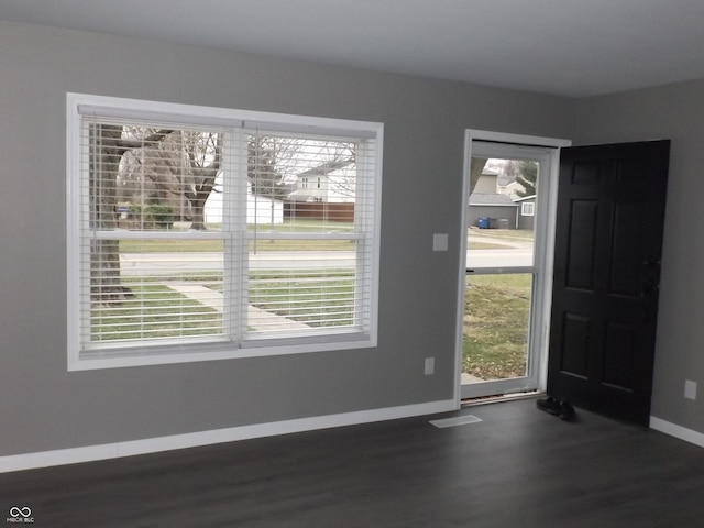 foyer entrance with dark wood-type flooring