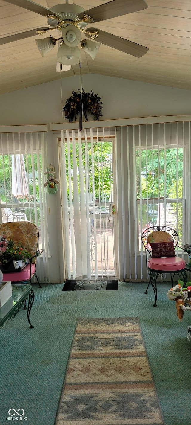 sunroom with vaulted ceiling, plenty of natural light, and wooden ceiling