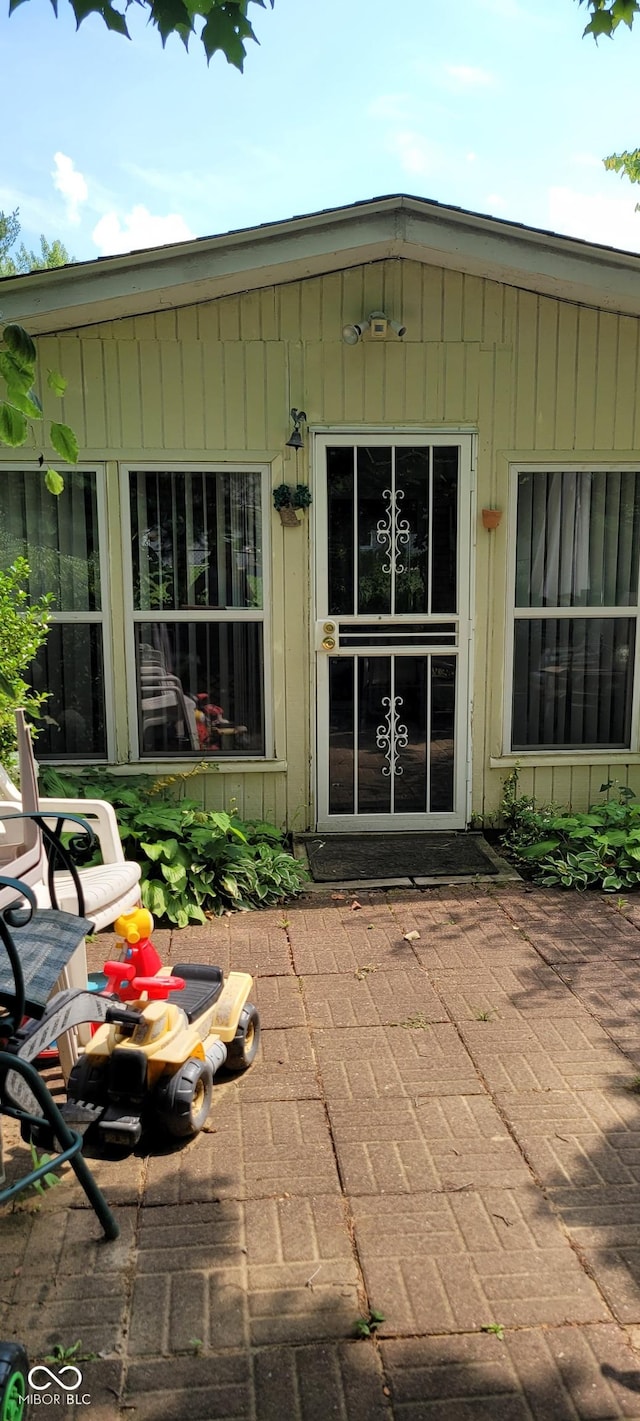 property entrance with a patio