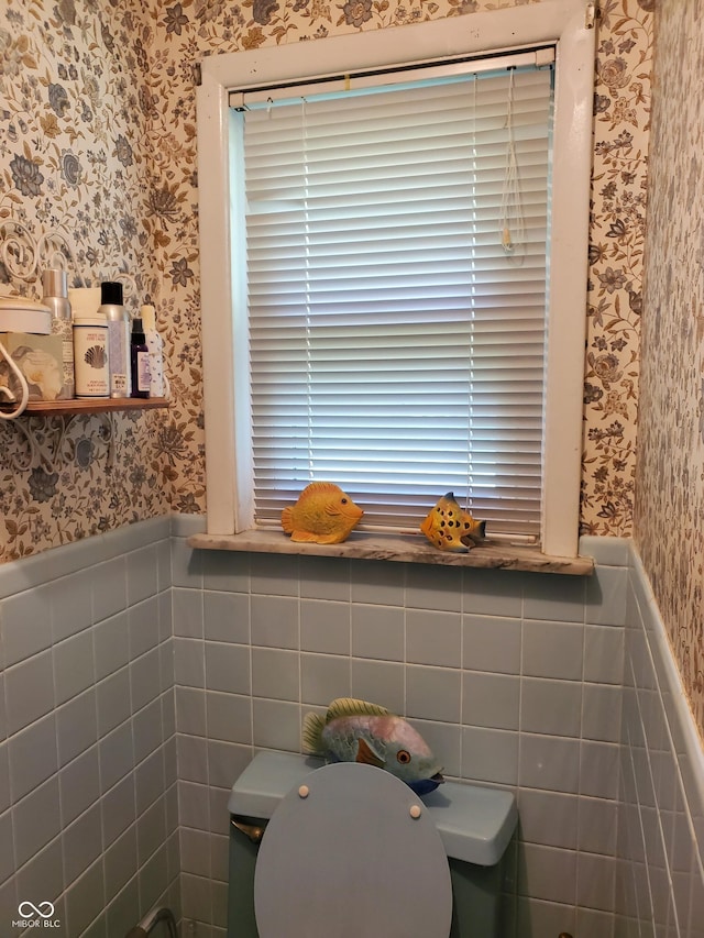 bathroom with tile walls