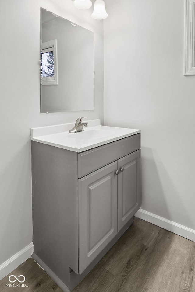 bathroom with vanity and hardwood / wood-style flooring