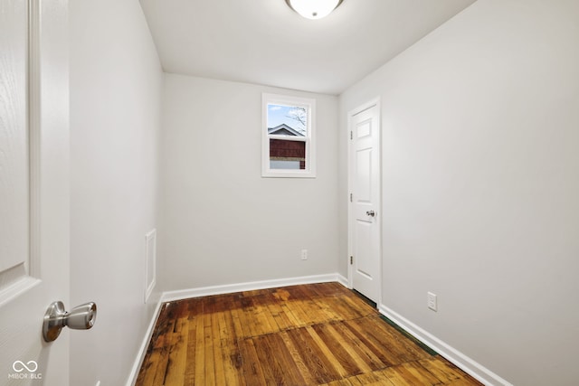 unfurnished room featuring hardwood / wood-style flooring