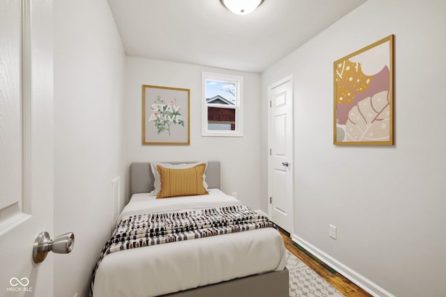 bedroom with wood-type flooring