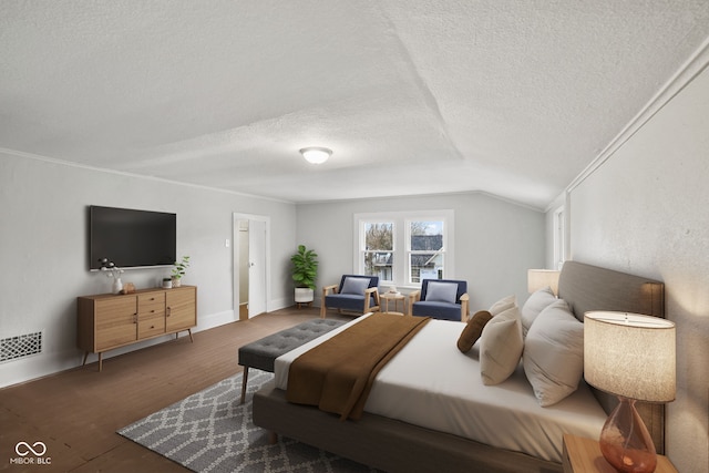 bedroom featuring a textured ceiling, dark hardwood / wood-style floors, vaulted ceiling, and ornamental molding