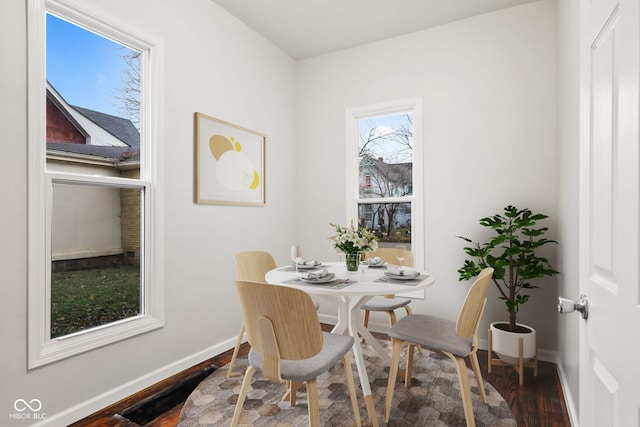 dining room with dark hardwood / wood-style floors