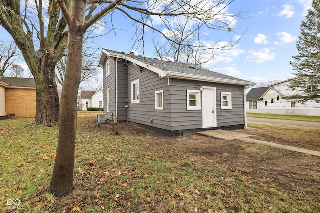 back of property featuring central AC unit