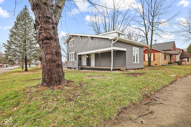 view of property exterior featuring a porch and a yard