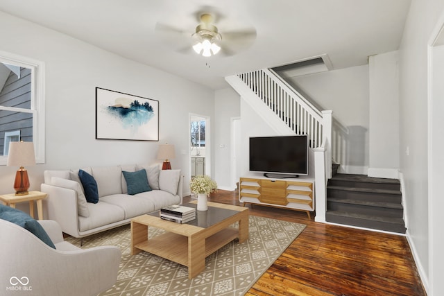 living room featuring hardwood / wood-style floors and ceiling fan