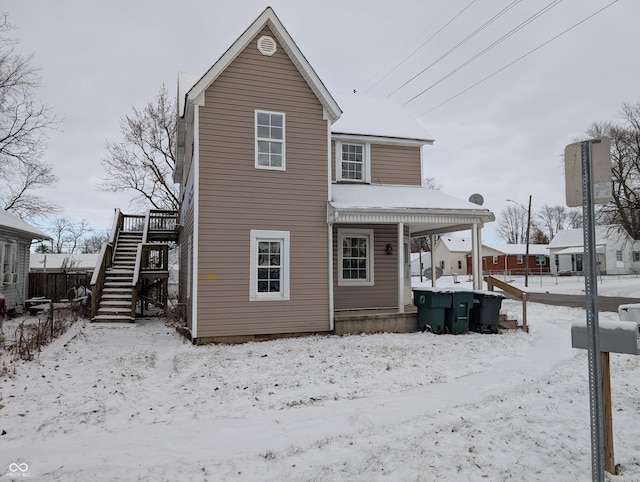 view of snow covered house