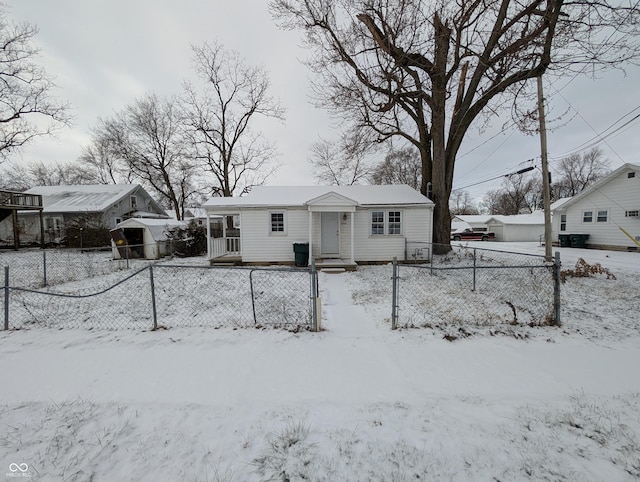 view of snow covered rear of property