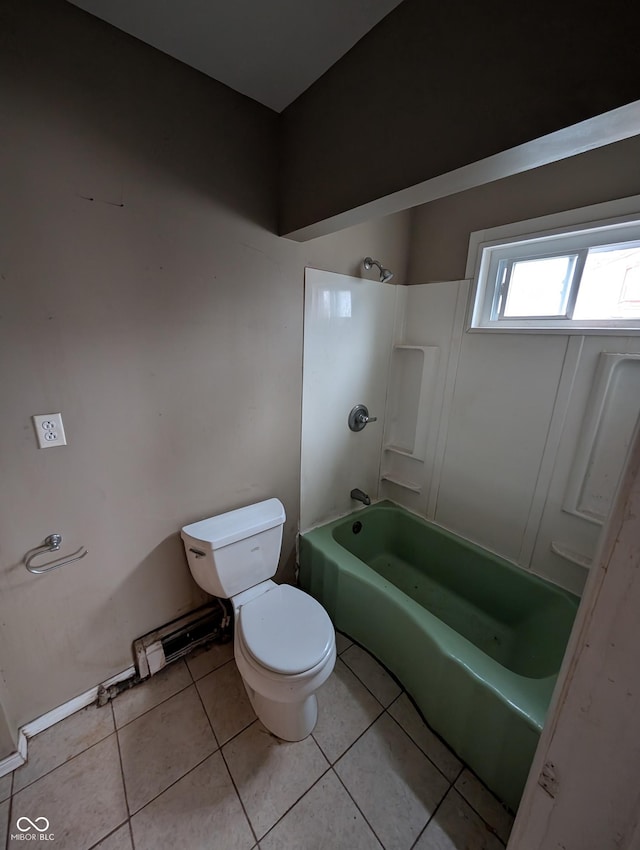 bathroom featuring tile patterned flooring, shower / bath combination, and toilet